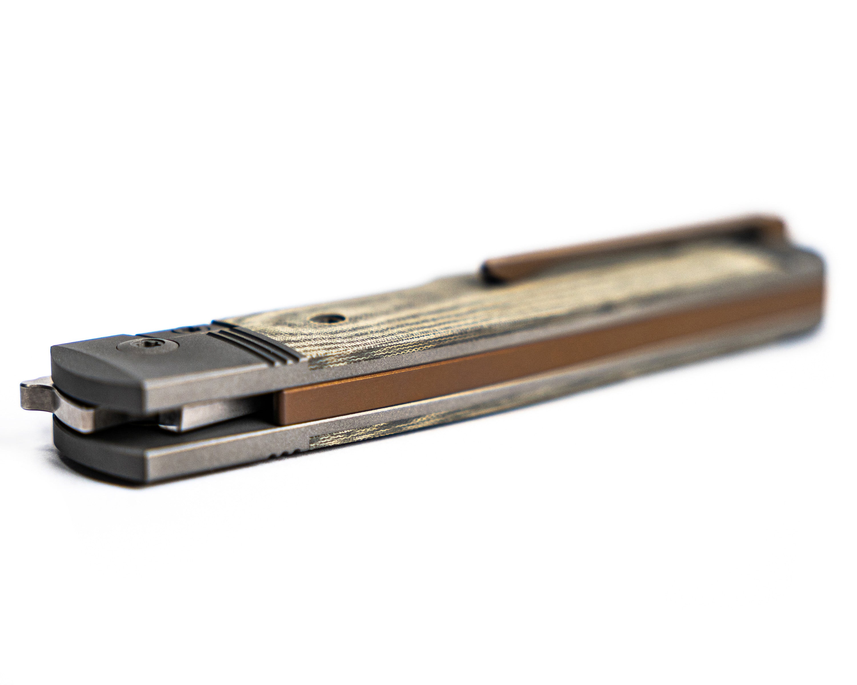 Gunslinger Jack Knife laying on its side with spine visible on a white background