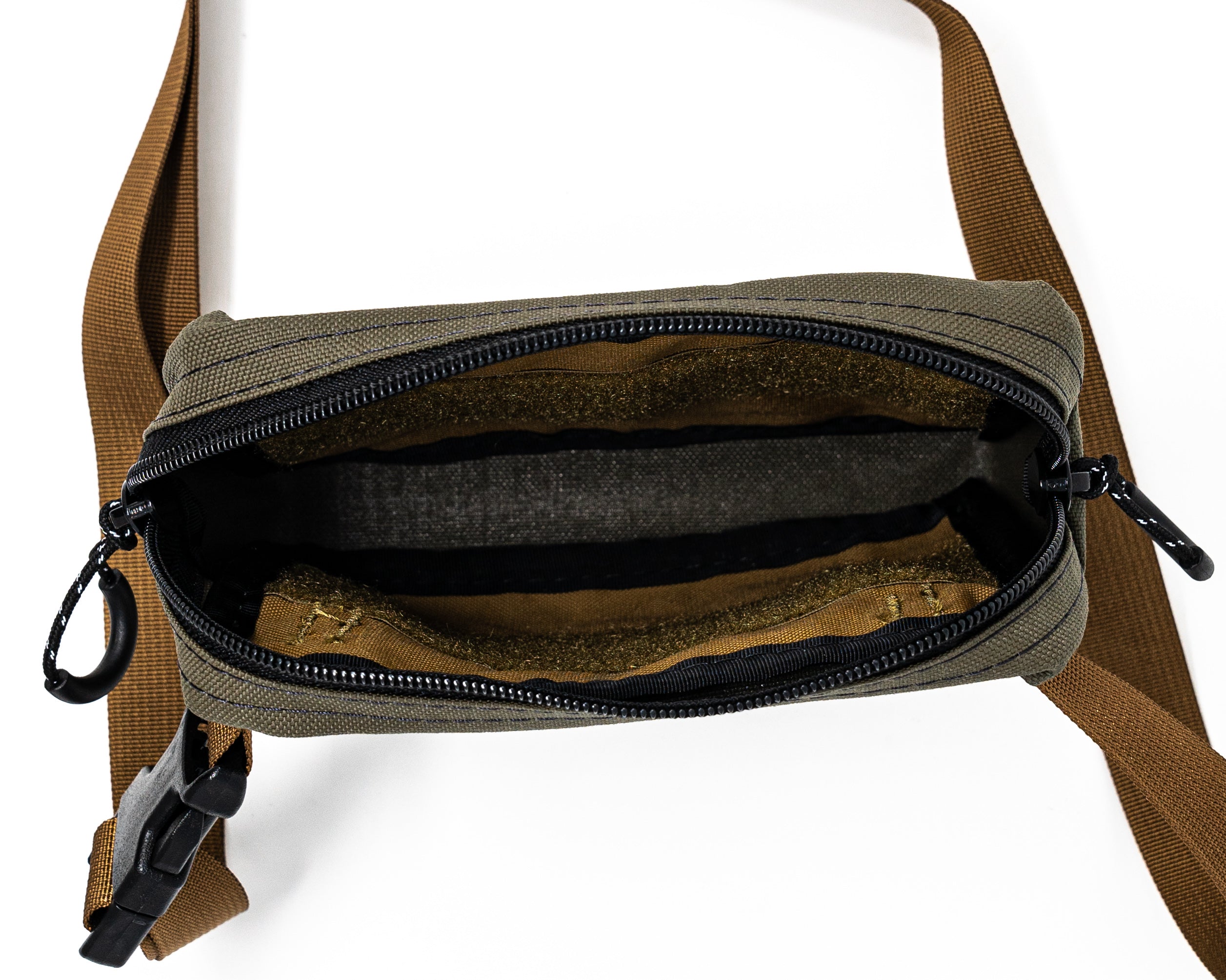 Overhead / interior view of bum bag in green and tan color way.