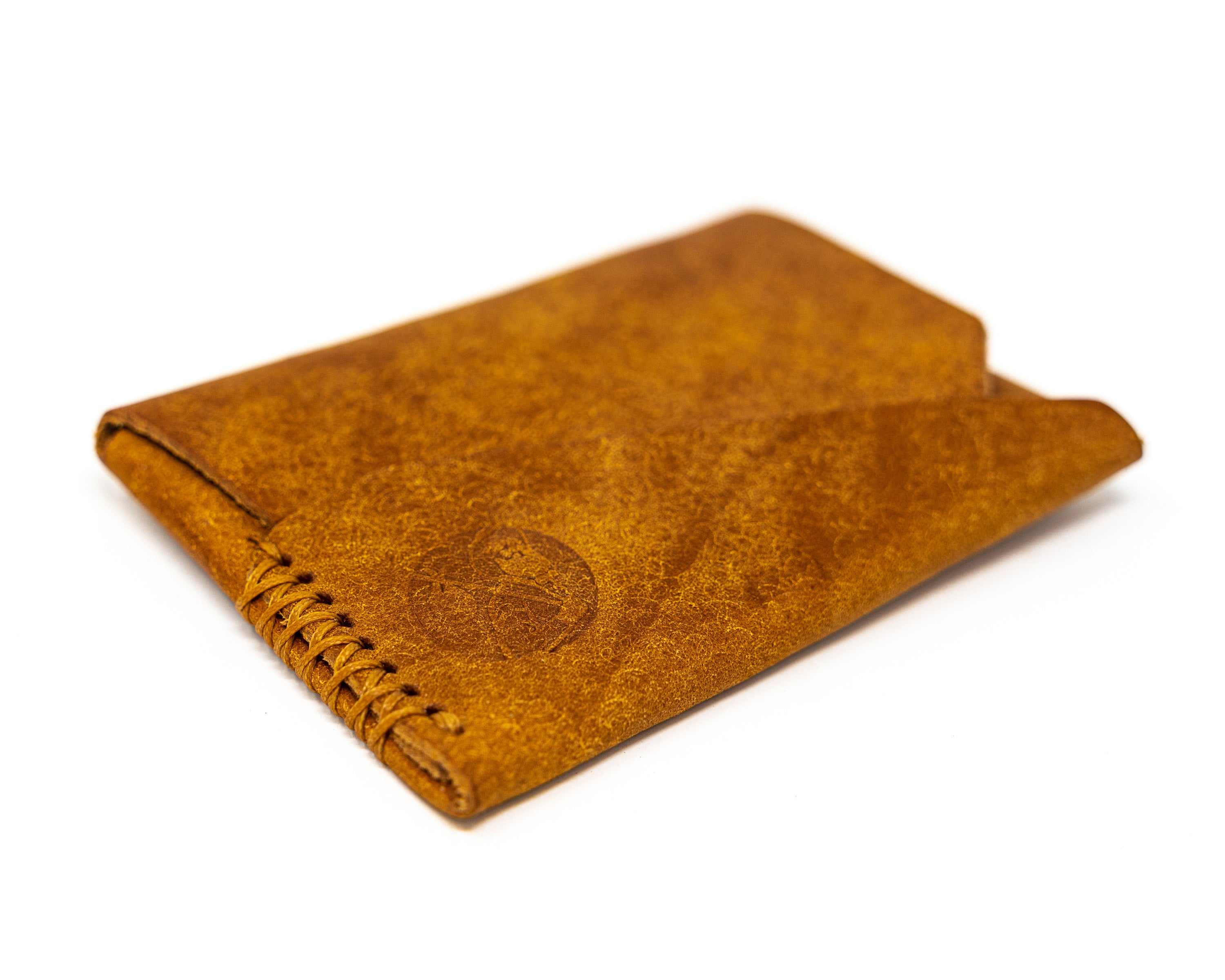 Carry Commission / Open Sea Leather Gun Deck Mini in cognac front sideways view on white background