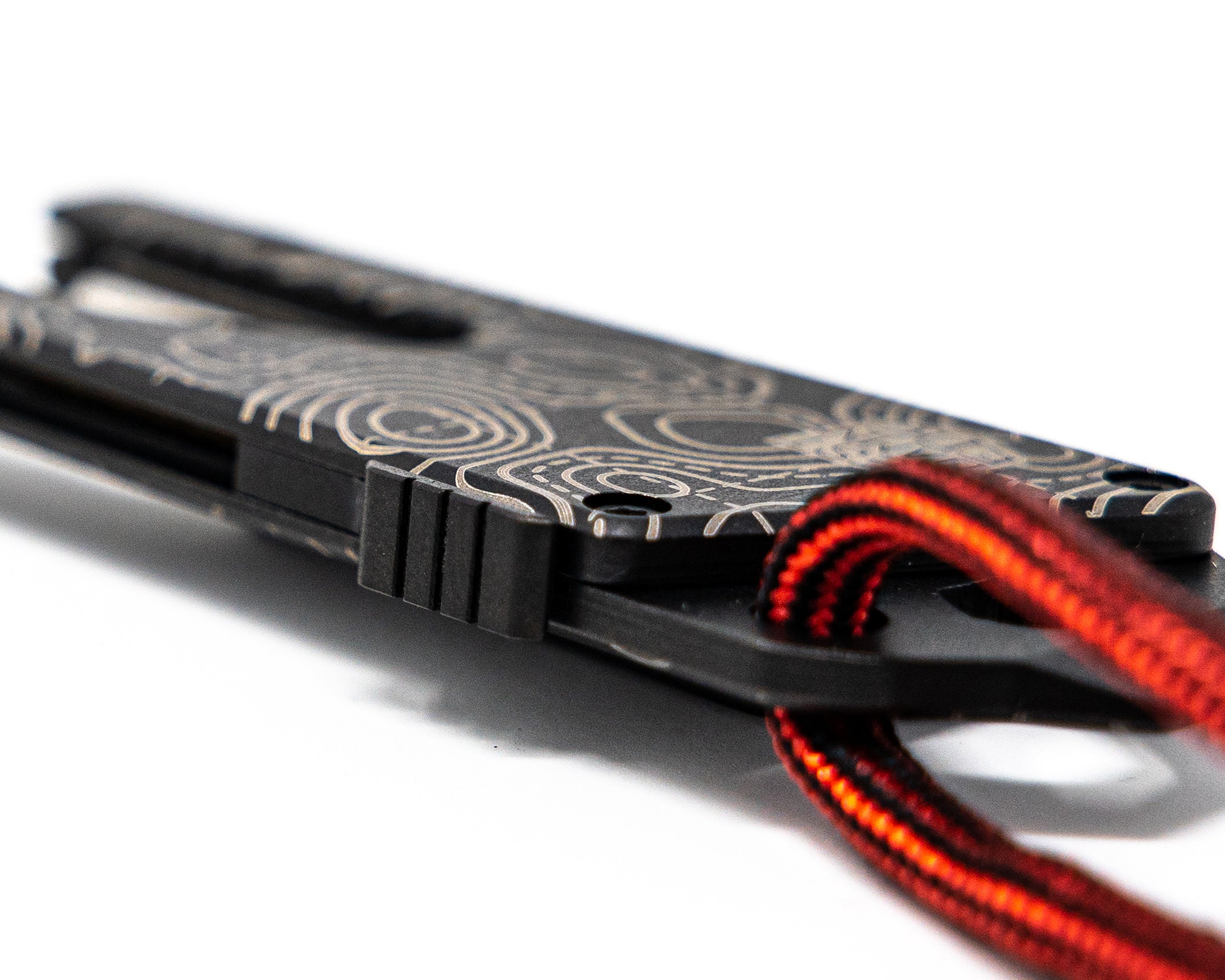 Side angle top view of Best Damn EDC TPT Slide Box Cutter Tool in Black Topo