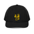 Front view of black trucker cap with Carry Commission logo of man holding bindle on shoulder in gold.