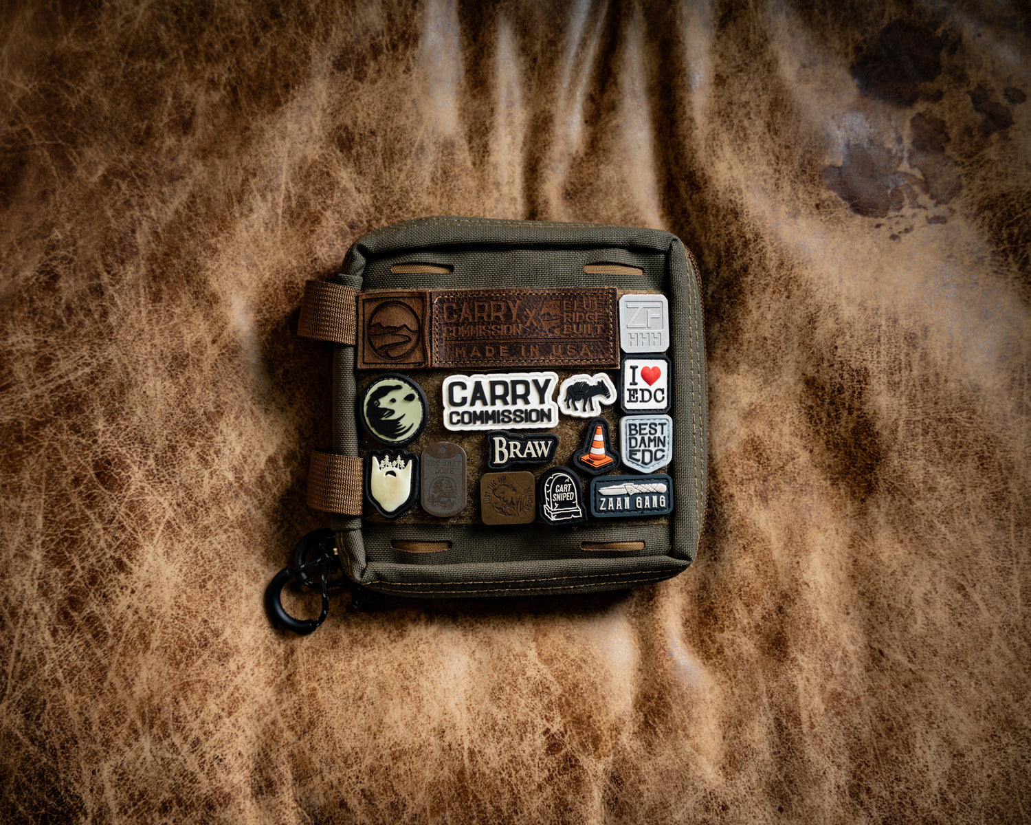 Carry Commission / Blue Ridge Overland Gear EDC Pouch Bundle overhead front view with ranger eye patches on leather background