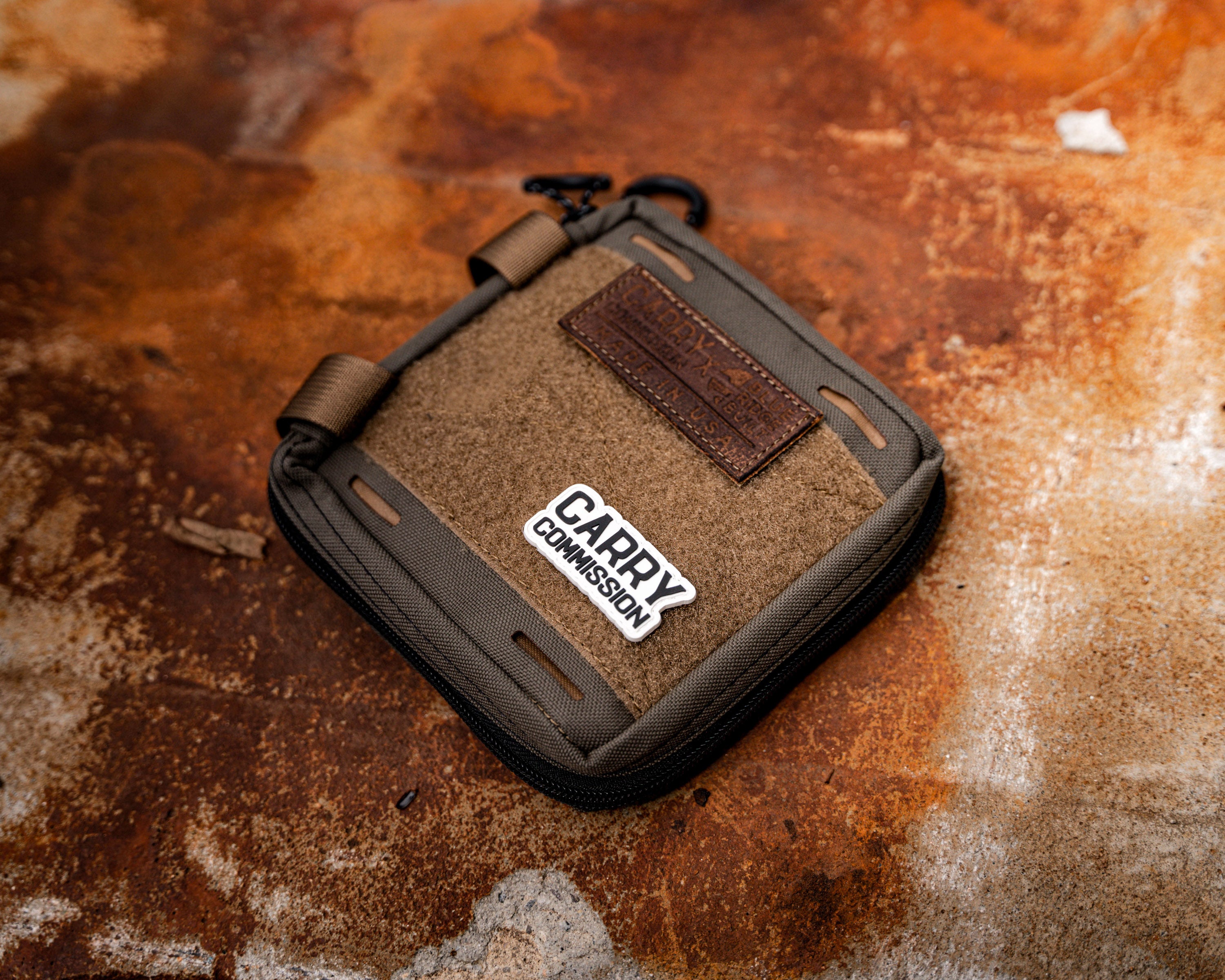 Carry Commission / Blue Ridge Overland Gear EDC Pouch Bundle overhead sideways front view sitting on rusting metal backdrop