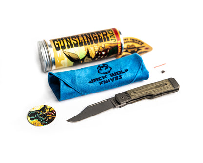 Gunslinger Jack Knife, packaging and cleaning cloth flat lay on white background