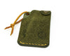 Top view of olive hitchhiker wallet slanted to the right on white background.