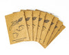 Packets of Juno Instant Coffee fanned out on a white background