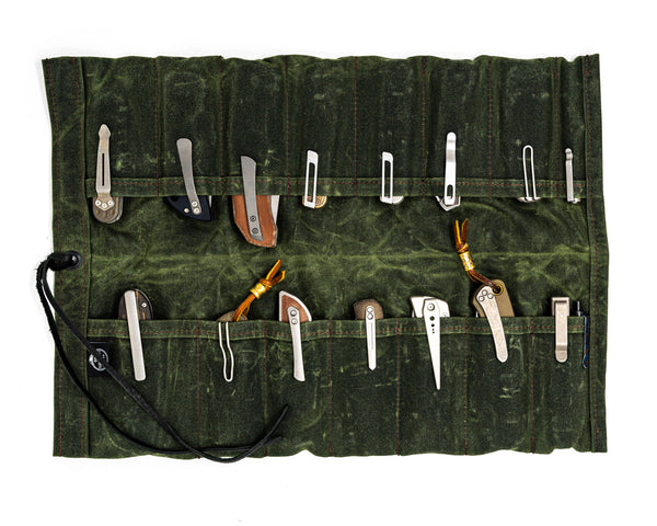 PNW Bushcraft Maple Waxed Canvas Knife Roll in Green with folding knives and tools on white background.