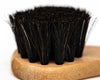 Close up of Smith's Leather Balm Horse Hair Dauber Brush on white background. 