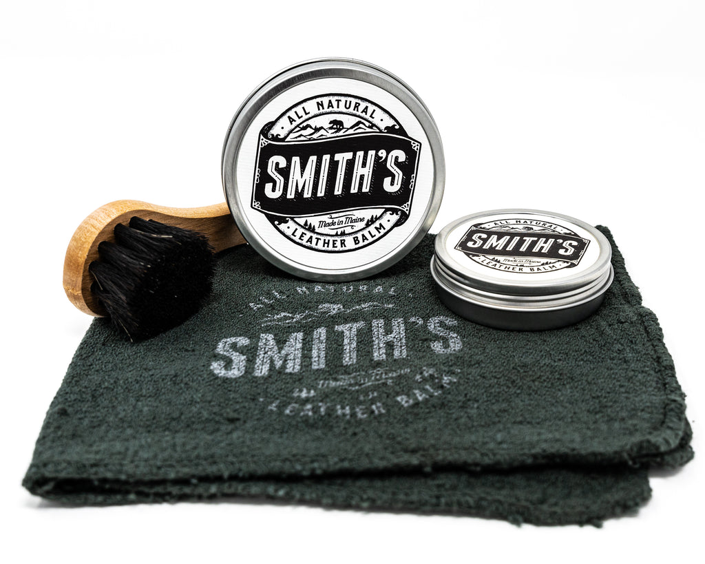 Smith's Leather Balm 1oz and 4oz Tin with Smith's Leather Balm Shop Rag and Leather Balm Horse Hair Dauber Brush on a white background. 