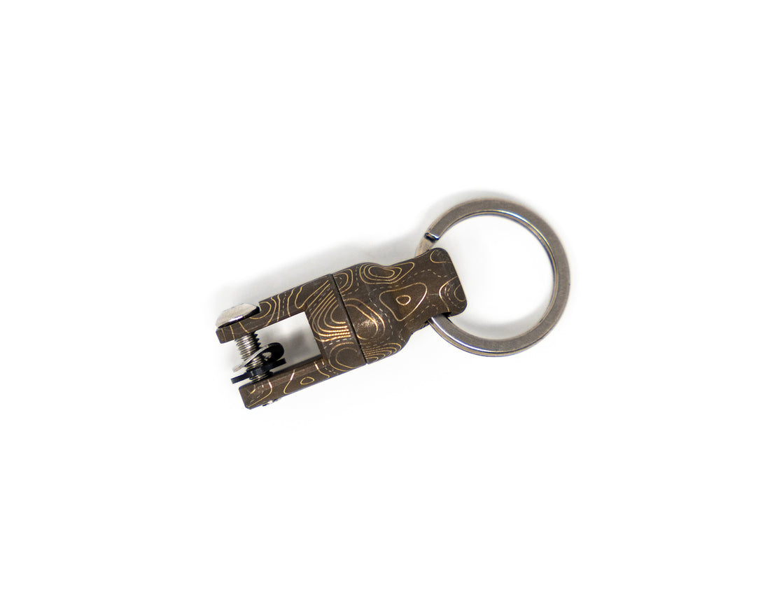 Carry Commission / Urban Carvers Keyper MQR Bronze Topo side view on white background