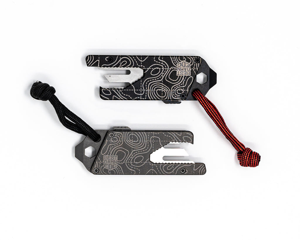Overhead view of Best Damn EDC TPT Slide Box Cutter Tool in Black & Stonewash Topo