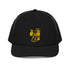 Front view of black trucker cap with Carry Commission logo of man holding bindle on shoulder in gold. 