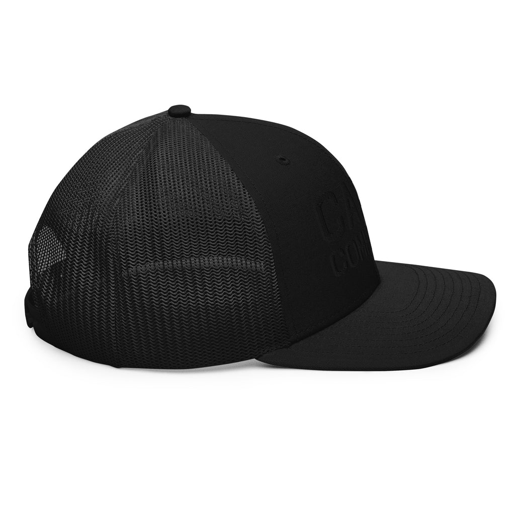 Left side view of black trucker cap with black thread Carry Commission Logo